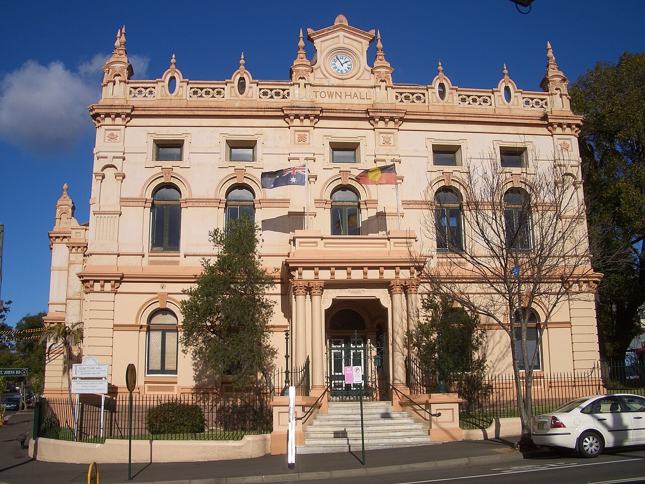 Glebe Town Hall’s ornate façade, with arched windows, a central clock, columns and decorative parapets, photographed in 2007.