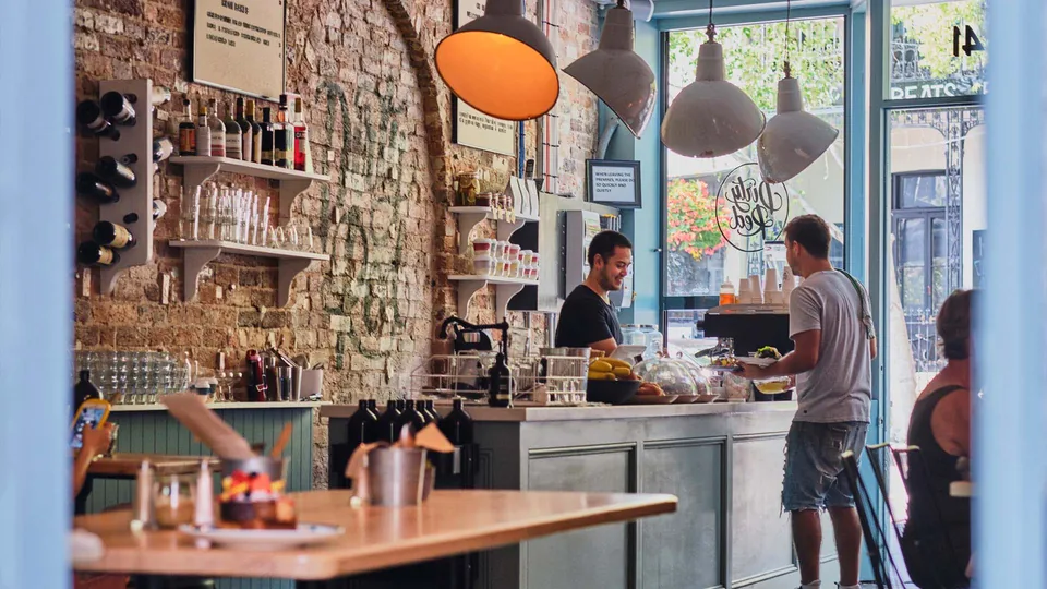 The café counter and sunlit front windows inside Dirty Red Glebe.