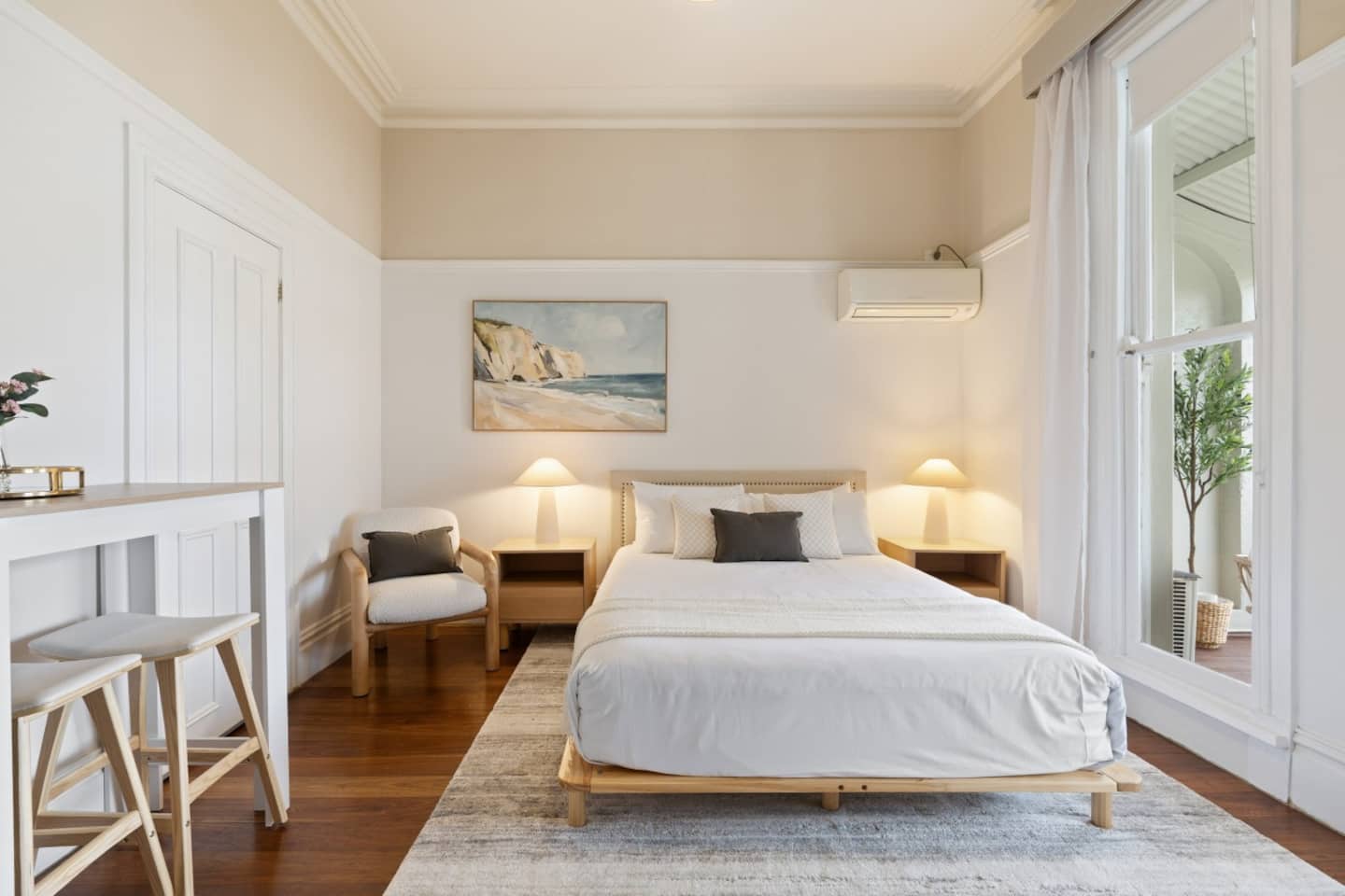The Clifftop Salon with the bed and clifftop artwork